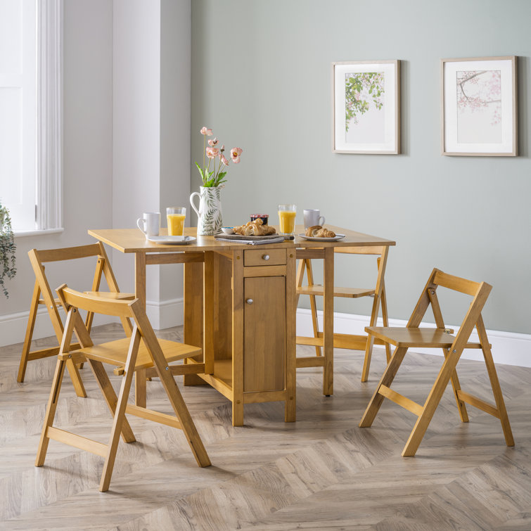 Folding table with chairs stored outlet inside